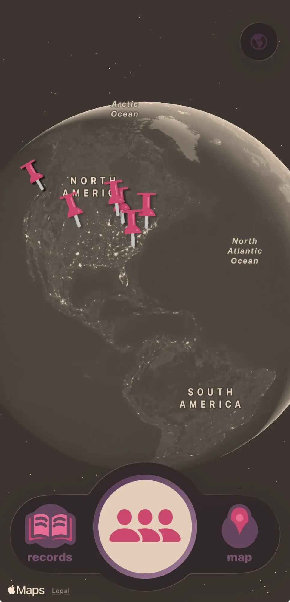 Heirloom family map: a sepia globe with pink pushpins at family places