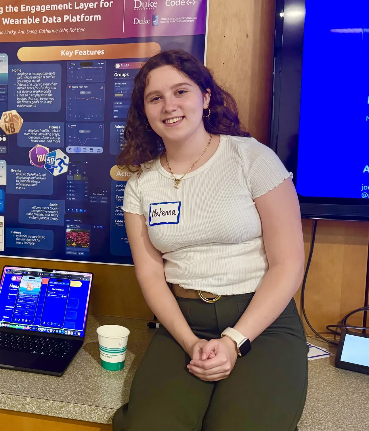 Makenna presenting design work at a poster session